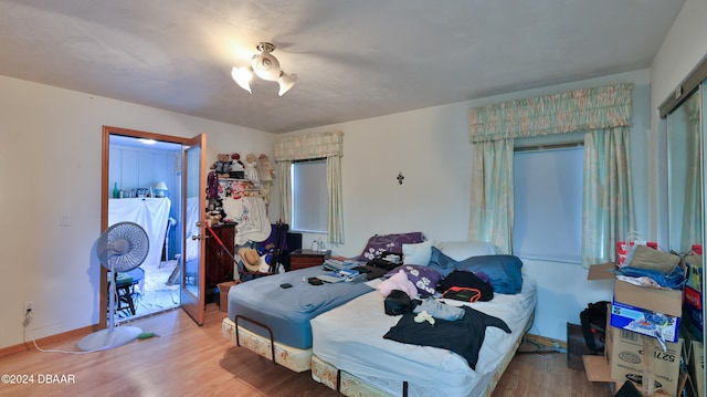 bedroom with wood-type flooring