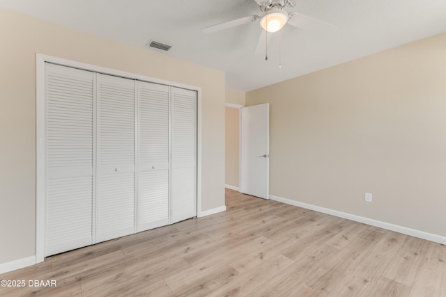 16 Wildwood Trl, Ormond Beach, FL 32174 - unfurnished bedroom with a closet, light wood-type flooring, baseboards, and a ceiling fan