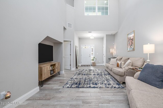 3417 Medici Blvd, New Smyrna Beach, FL 32168 - living room with a high ceiling and wood finished floors