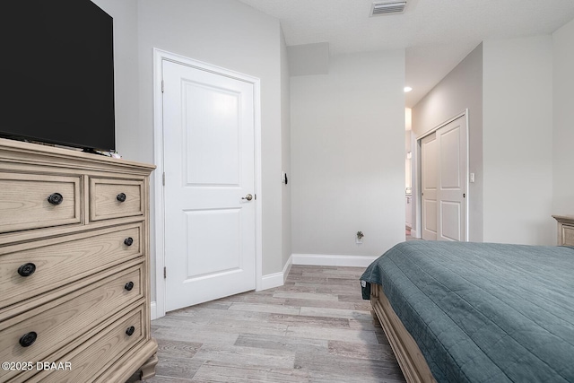 3417 Medici Blvd, New Smyrna Beach, FL 32168 - bedroom with light wood-style flooring and recessed lighting