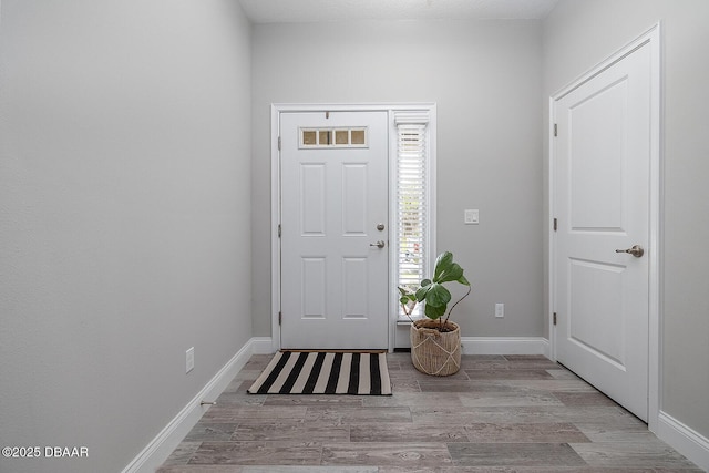 3417 Medici Blvd, New Smyrna Beach, FL 32168 - foyer entrance featuring wood finished floors and baseboards