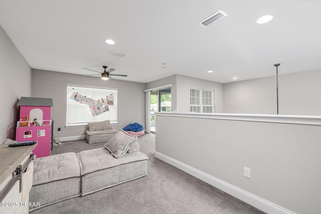 3417 Medici Blvd, New Smyrna Beach, FL 32168 - carpeted living room featuring a ceiling fan and recessed lighting