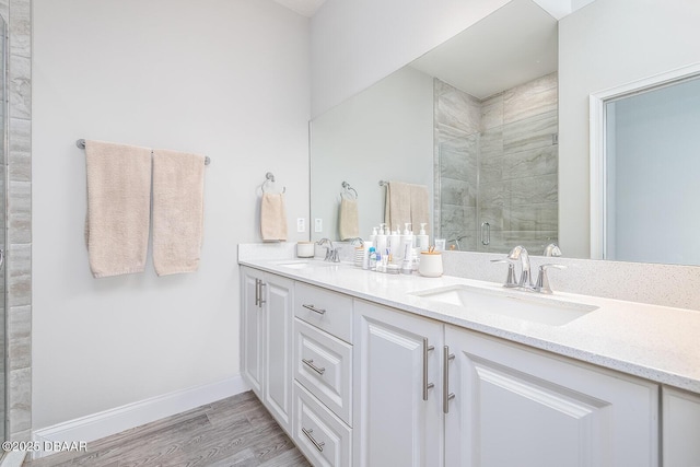 3417 Medici Blvd, New Smyrna Beach, FL 32168 - full bath with double vanity, a shower stall, and wood finished floors