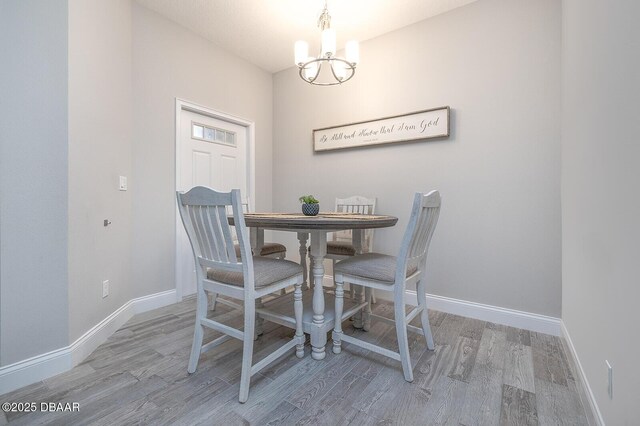 3417 Medici Blvd, New Smyrna Beach, FL 32168 - dining room with a chandelier and wood finished floors