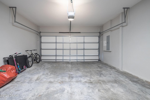 3417 Medici Blvd, New Smyrna Beach, FL 32168 - garage featuring electric panel and a garage door opener