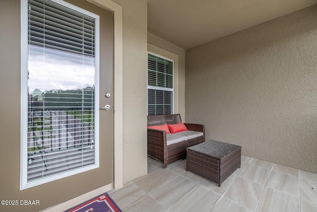 3417 Medici Blvd, New Smyrna Beach, FL 32168 - entrance to property featuring stucco siding and a balcony