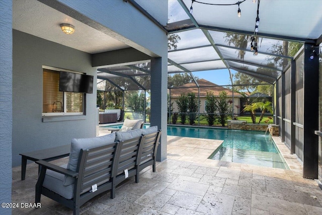 view of pool with an outdoor hangout area, a patio area, glass enclosure, and pool water feature