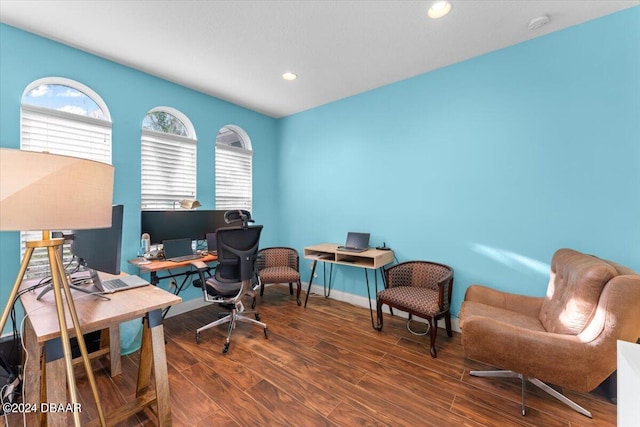 office with dark wood-type flooring