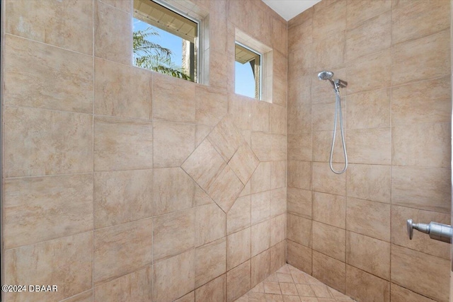 bathroom with tiled shower