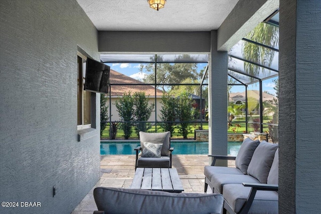 sunroom / solarium featuring plenty of natural light and a pool