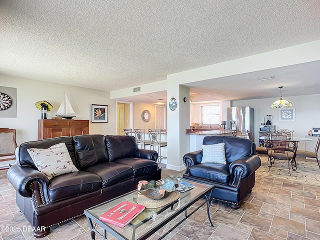 living room with a textured ceiling