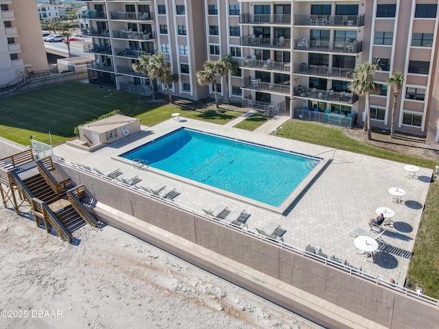 view of swimming pool with a patio