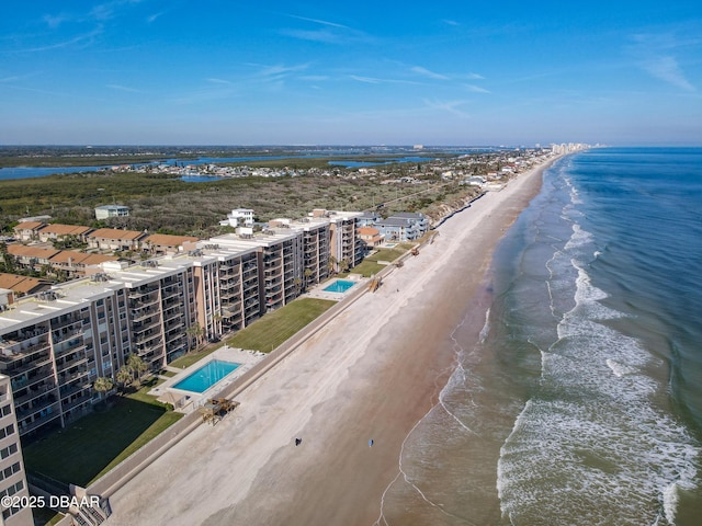 bird's eye view featuring a water view and a view of the beach