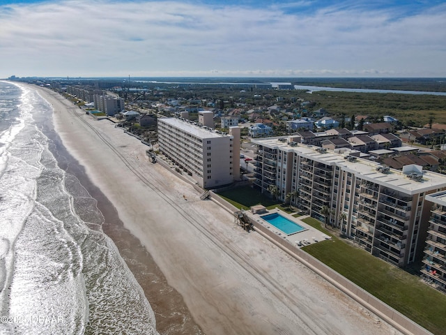 bird's eye view featuring a view of the beach and a water view