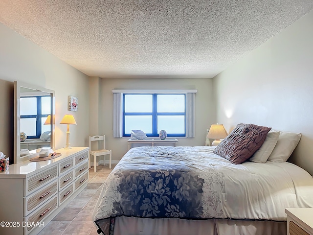 tiled bedroom with a textured ceiling