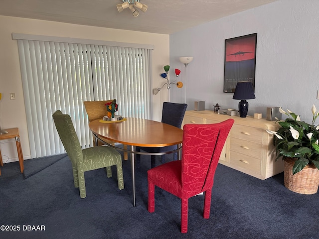 dining area featuring carpet flooring