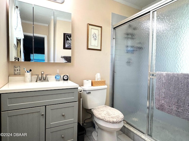 bathroom featuring a stall shower, vanity, toilet, and crown molding