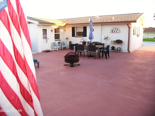 view of patio / terrace featuring a fire pit and outdoor dining area