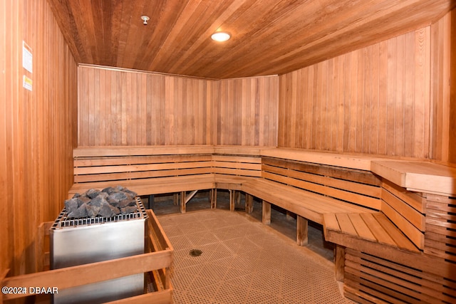 view of sauna with wood walls and wood ceiling