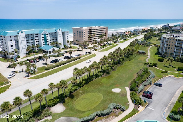 aerial view with a water view and a beach view