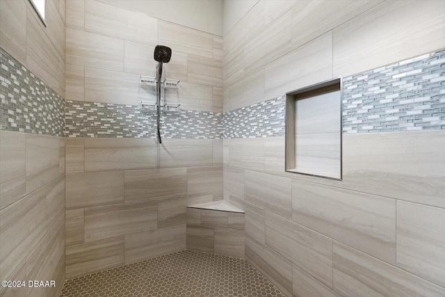 bathroom with a tile shower