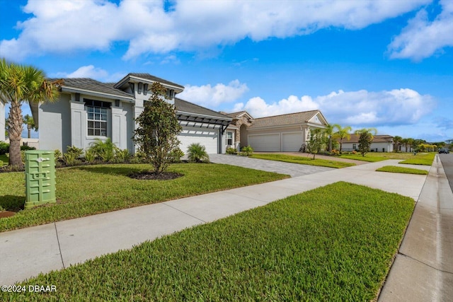 view of front of property featuring a garage and a front yard