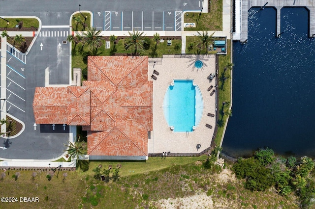 birds eye view of property with a water view