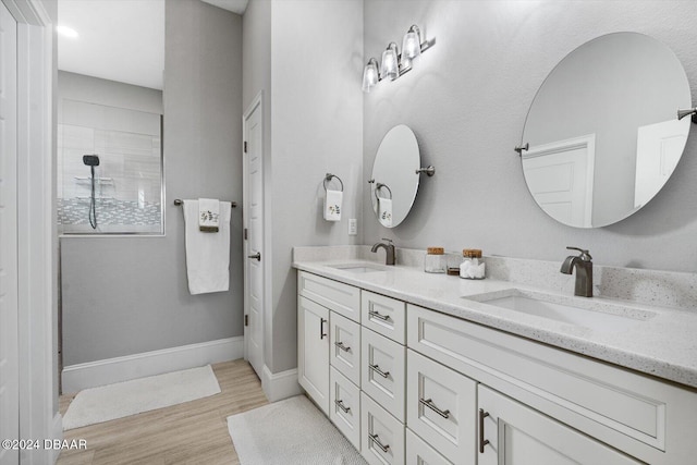 bathroom with vanity and hardwood / wood-style floors