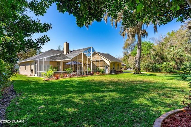 view of yard with a lanai