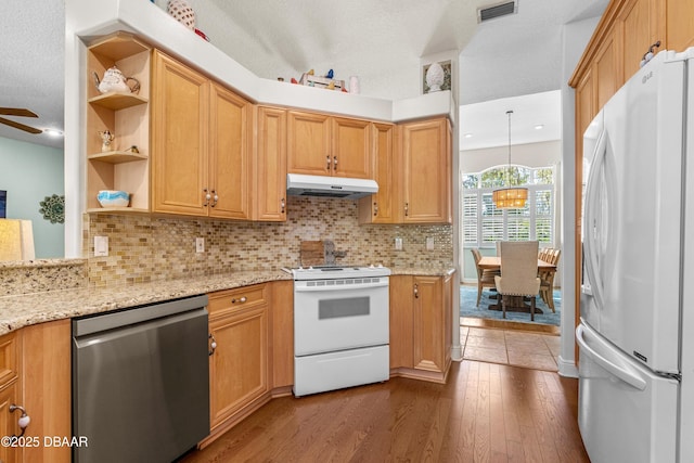 kitchen featuring visible vents, open shelves, under cabinet range hood, white appliances, and dark wood-style flooring