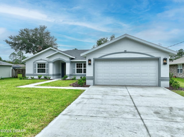 ranch-style house featuring a garage and a front yard