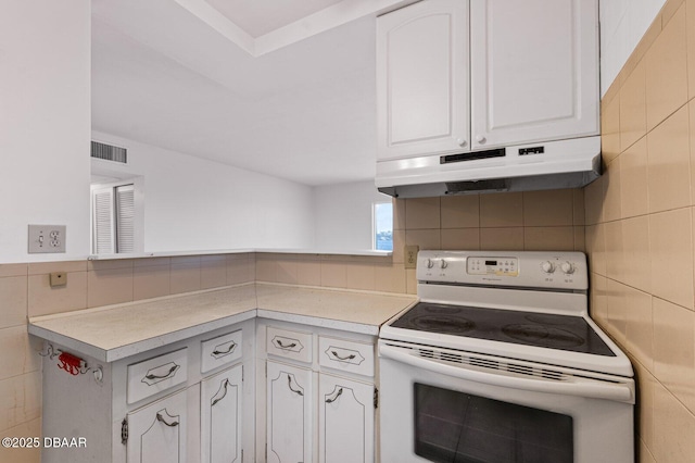 kitchen featuring tile walls, light countertops, white electric range, white cabinetry, and under cabinet range hood