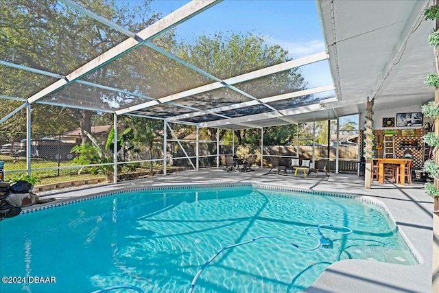 view of pool featuring a patio and a lanai