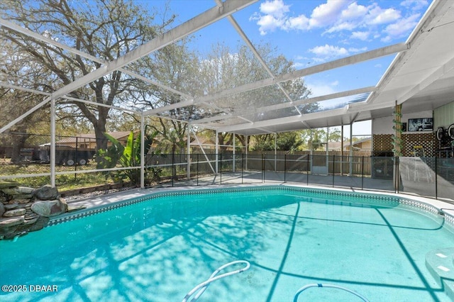 view of pool featuring a fenced in pool, a patio area, a lanai, and fence