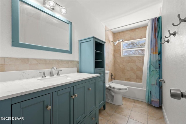 full bathroom featuring shower / bath combo with shower curtain, toilet, vanity, and tile patterned flooring