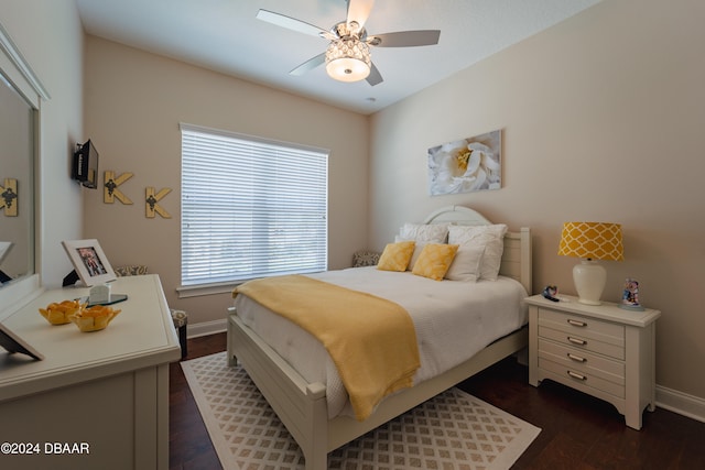 bedroom with dark hardwood / wood-style floors and ceiling fan