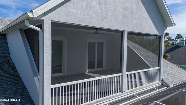 view of side of property featuring ceiling fan