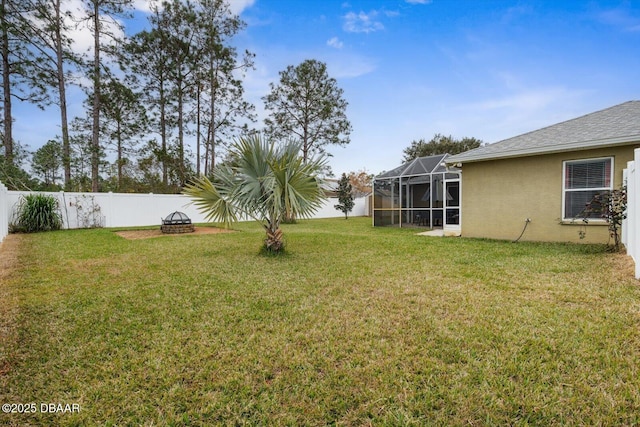 view of yard featuring an outdoor fire pit