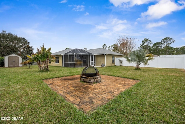 view of yard featuring an outdoor fire pit and a shed