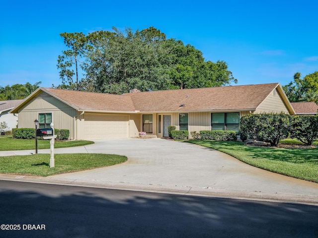 257 Sweet Bay Ave, New Smyrna Beach, FL 32168 - ranch-style home with a garage, a front lawn, and concrete driveway