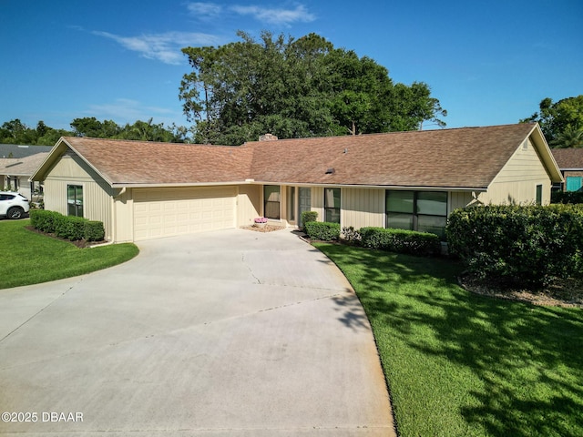 257 Sweet Bay Ave, New Smyrna Beach, FL 32168 - single story home featuring an attached garage, driveway, a front lawn, and a chimney