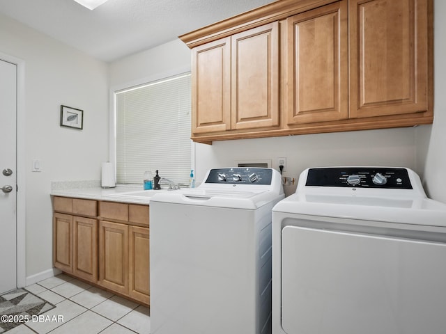 257 Sweet Bay Ave, New Smyrna Beach, FL 32168 - laundry room with cabinet space, washing machine and clothes dryer, and light tile patterned floors