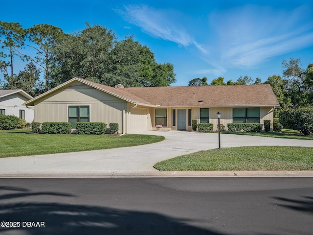 257 Sweet Bay Ave, New Smyrna Beach, FL 32168 - single story home with a garage, driveway, and a front lawn
