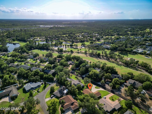 257 Sweet Bay Ave, New Smyrna Beach, FL 32168 - aerial view of property's location with a large body of water, a golf course, and nearby suburban area