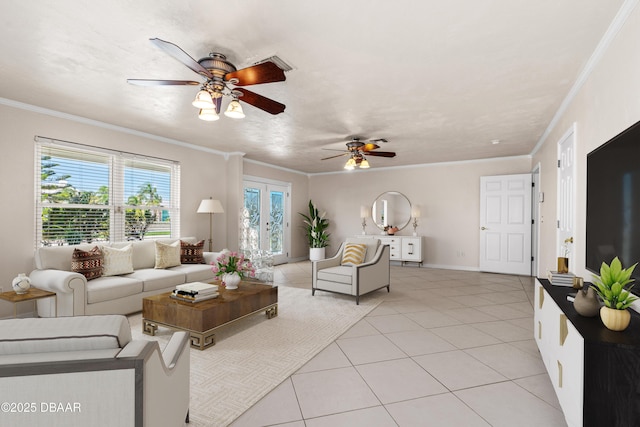 living area with ceiling fan, light tile patterned flooring, ornamental molding, and baseboards