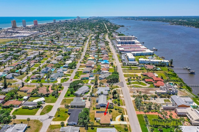 aerial perspective of suburban area with a large body of water