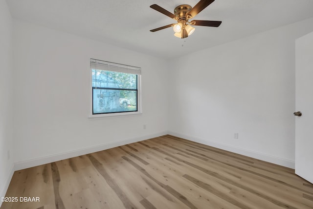 empty room featuring light hardwood / wood-style flooring and ceiling fan