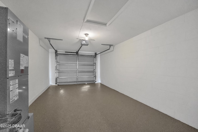 garage featuring heating unit and a garage door opener