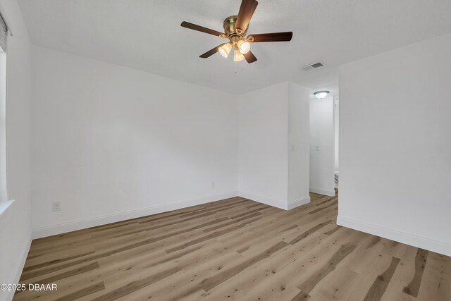 unfurnished room with ceiling fan and light hardwood / wood-style flooring