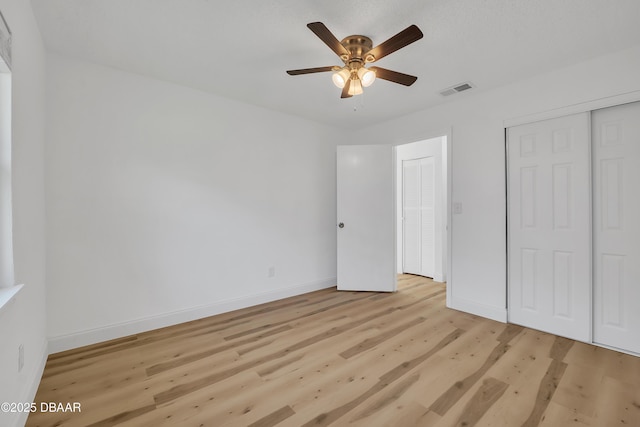 unfurnished bedroom featuring ceiling fan and light hardwood / wood-style floors